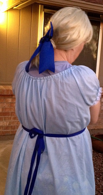 Back of Wendy Darling costume showcasing a light blue night gown and dark Blue Ribbon