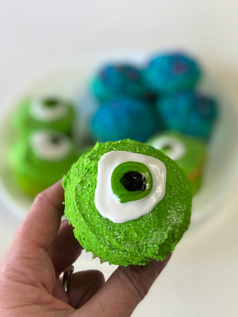 green frosted cupcake with giant green eye