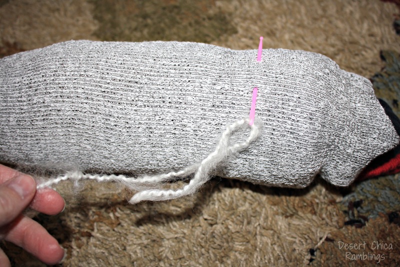 Pull yarn through top of sock head stick horse