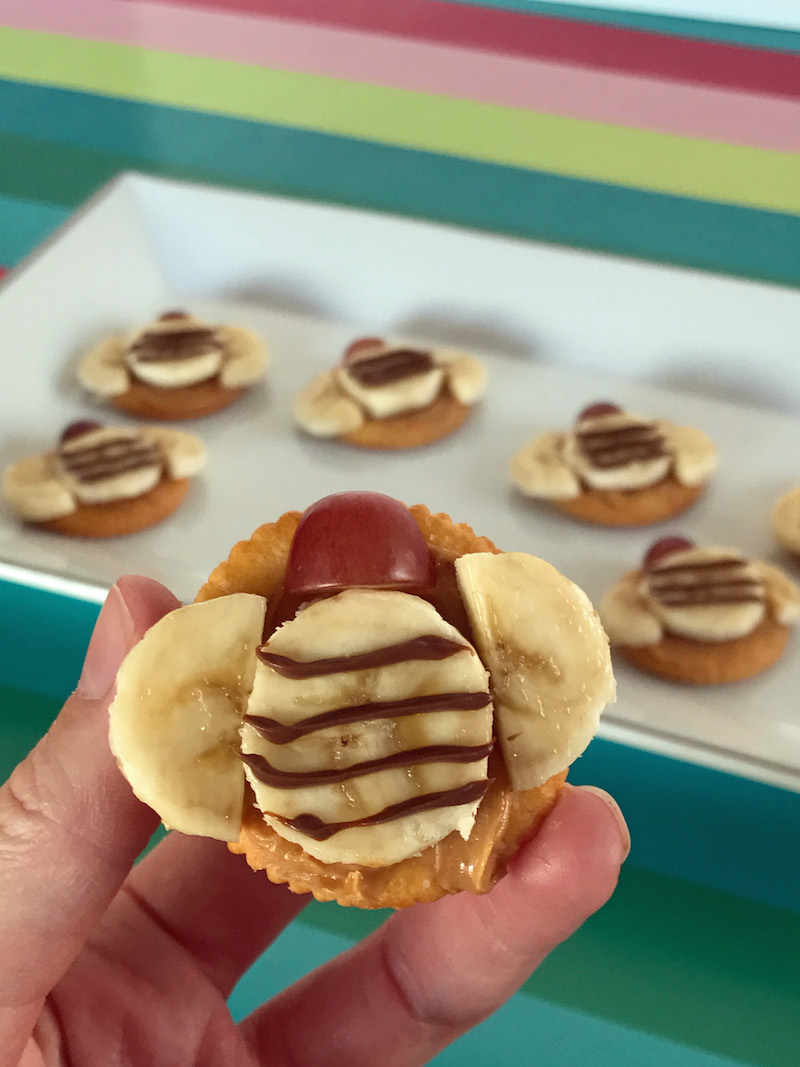 Salty and sweet plus fun to eat, peanut butter and banana bumble bees are an amazingly easy, kid-friendly snack idea using RITZ Crackers!