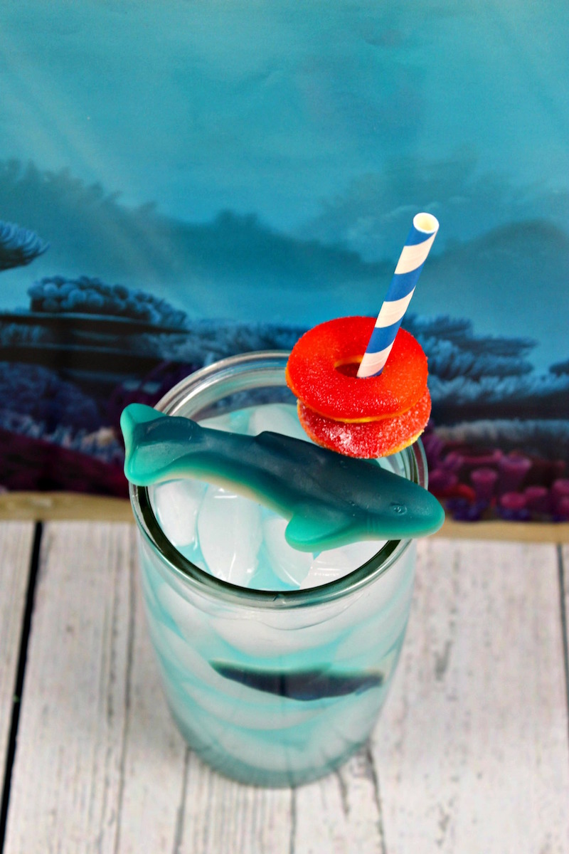 Try making this fun kids shark drink to enjoy while watching all the shark action during shark week. It's also perfect for a shark party or ocean party.