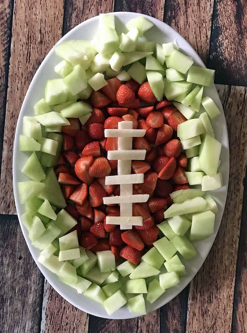 Looking for healthy Super Bowl ideas or lighter party snacks? A football fruit tray works as an appetizer or dessert idea for the big game. It's a simple and fun recipe that kids will love too.