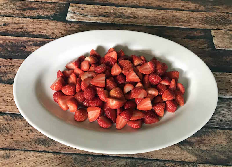 Start with strawberries to create a football fruit tray