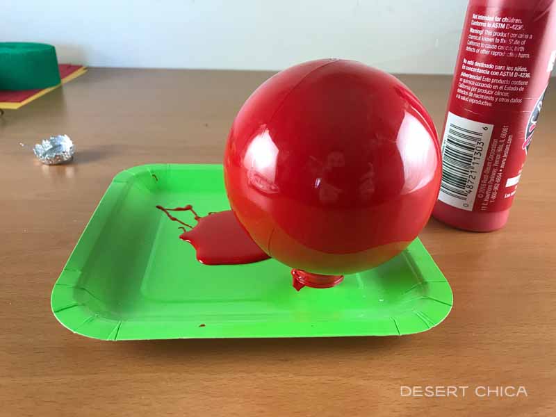 Dump out excess red paint when making the tomato head ornament