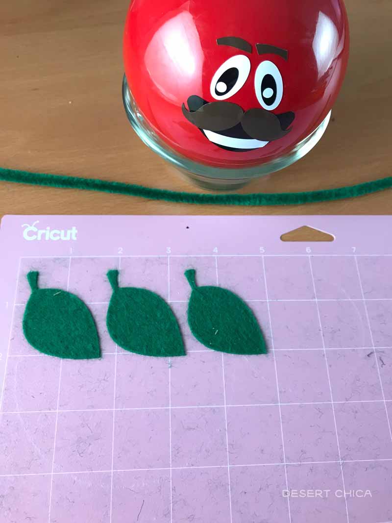 Use cricut maker to cut out green felt leaves for the DIY fortnite ornament