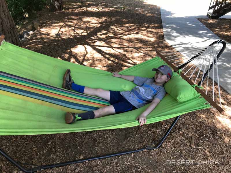 Relaxing in a hammock at the lodge at Yosemite Lakes RV Resort
