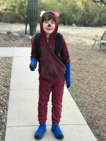 kid wearing a homemade fox in socks costume