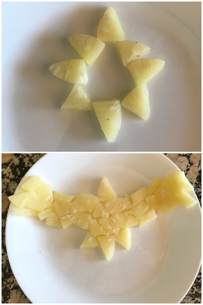 cut pineapple for a Captain Marvel shaped fruit tray