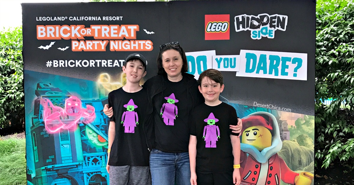 mom and 2 kids wearing black shirts with LEGO witch minifigures