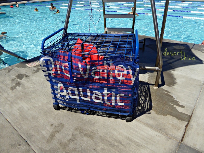 Basket of life vests at a pool