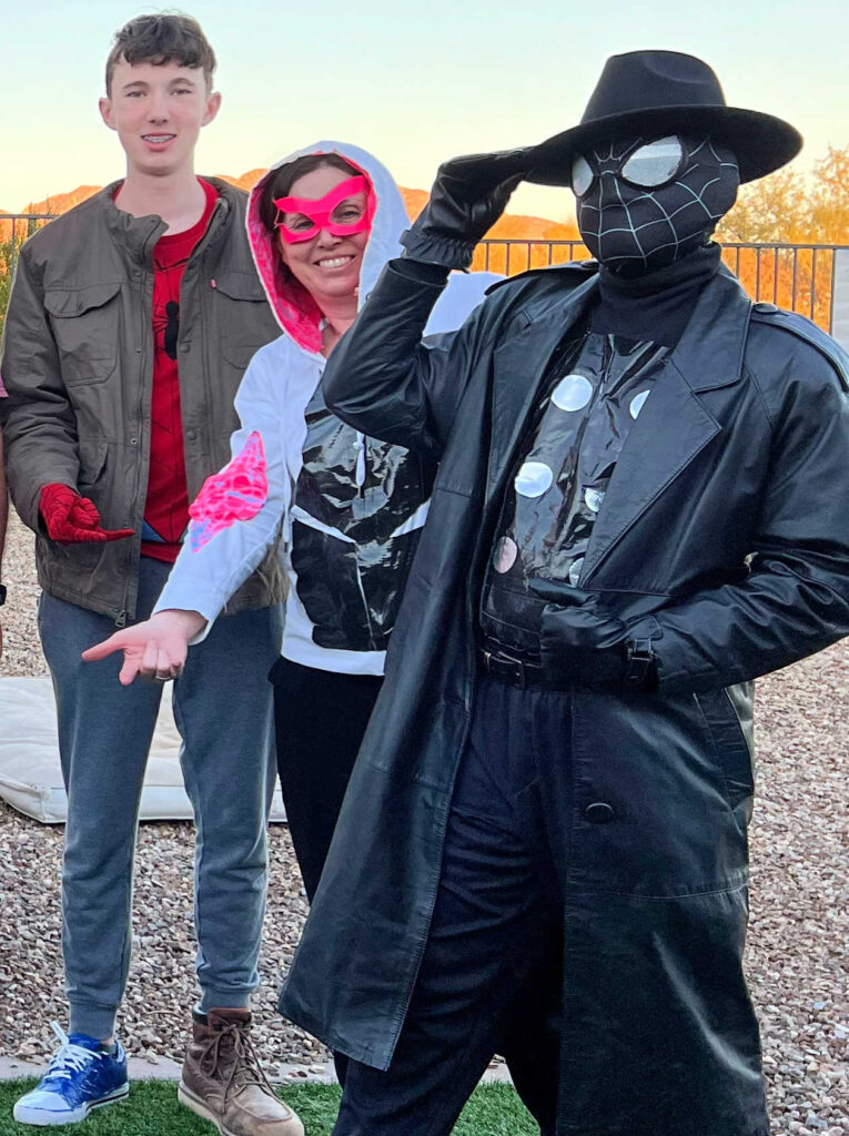 3 people wearing costumes from the Spider-Verse: Peter B. Parker, Spider-Gwen and Spider-Man Noir