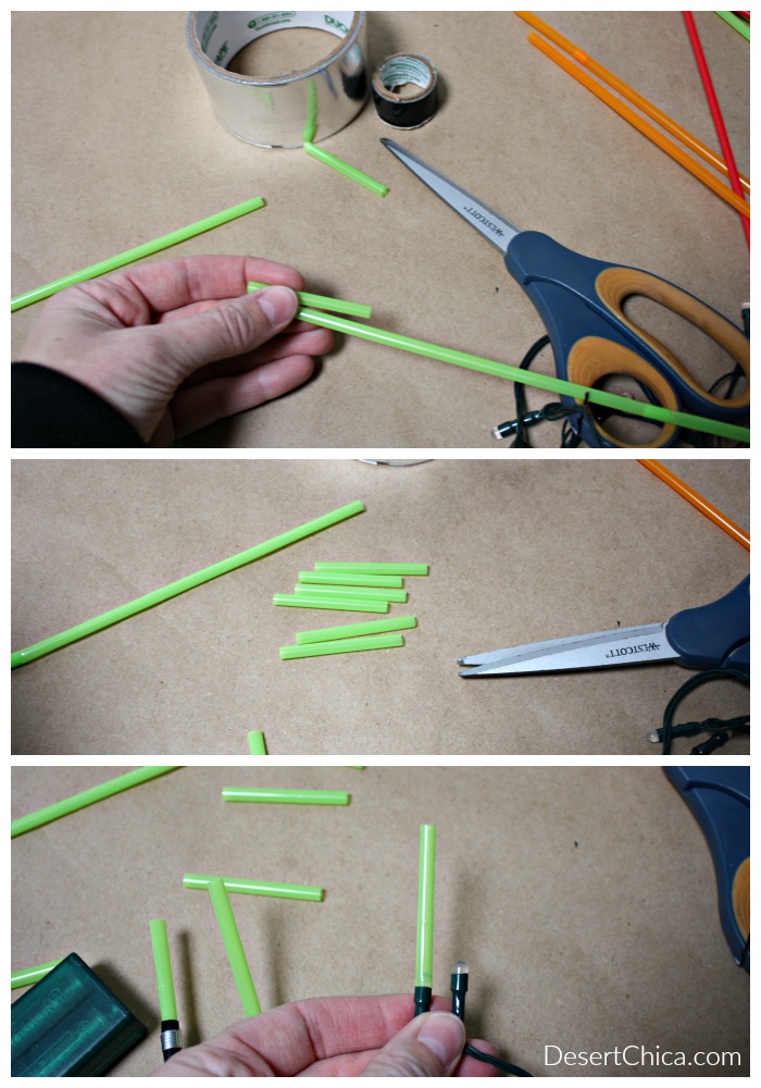 Cutting pieces of green straws to add to add to a string of LED lights for Star Wars Christmas Lightsaber lights