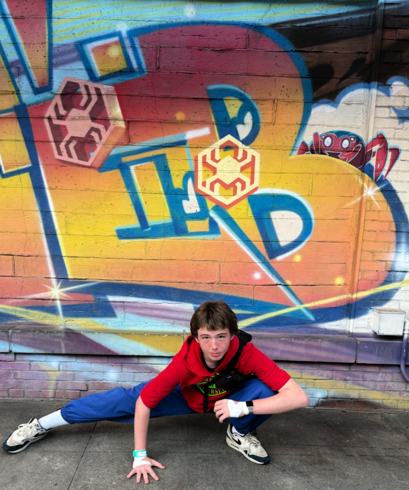 Bombastic Bag-Man Costume Spider-Man Pose in front of graffiti wall at Disney California Adventure's Avengers Campus