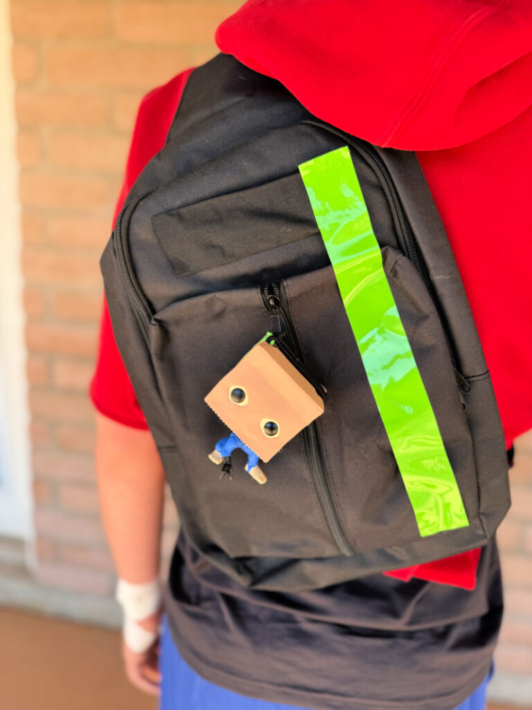 Bombastic Bag-Man Sling Back with green stripe and bombastic  bag-man figure