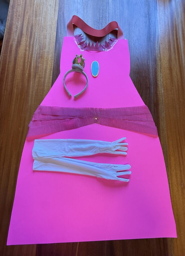 Homemade pink Princess Peach costume with crown headband and long white gloves